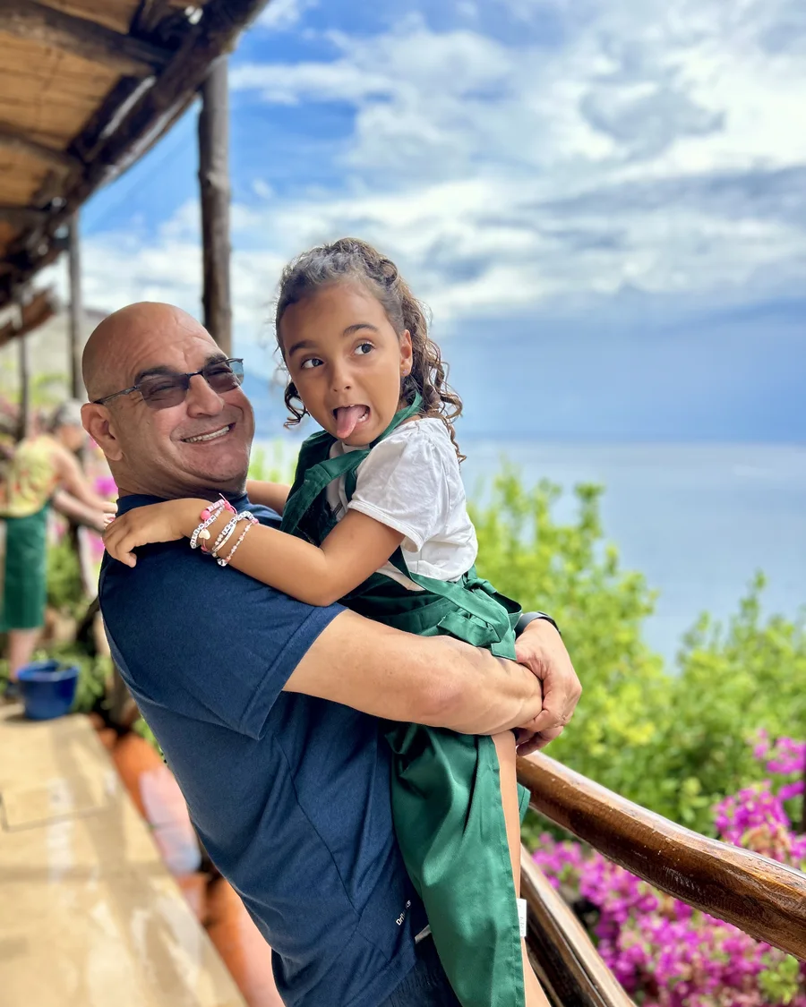 Michael Kovnick holding his granddaughter Aria on the Amalfi Coast