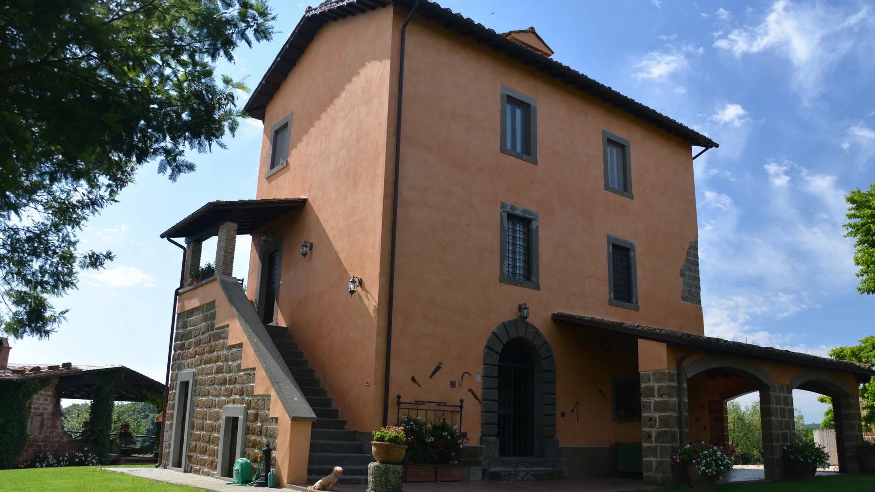 Villa Eddarella, the restored farmhouse in Soriano nel Cimino, Italy, with its stone staircase and loggia